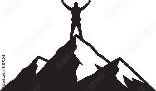 Man Standing on Mountain Peak with Arms Raised