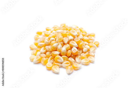 Raw corn grains isolated on white background