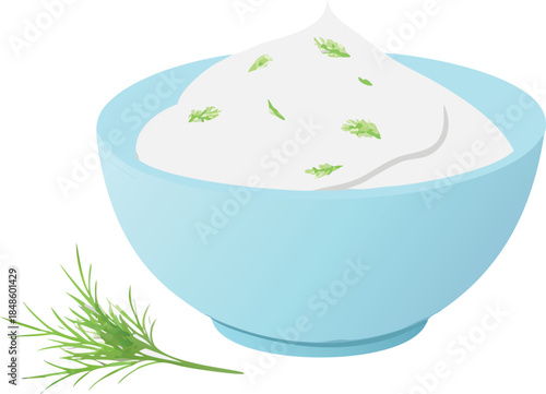 A light blue bowl filled with creamy white dip and fresh herbs