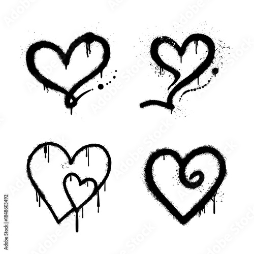 set of black graffiti spray painted heart shapes with paint drips