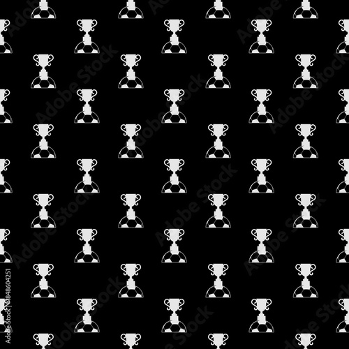 Soccer ball and trophy seamless pattern isolated on black background