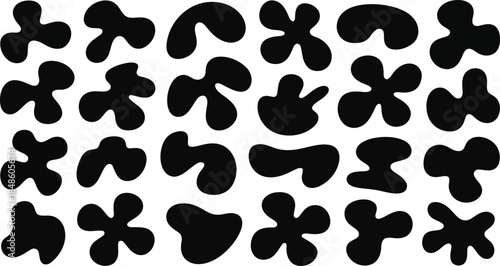 Many different irregular black organic shapes spread out across a pristine white canvas