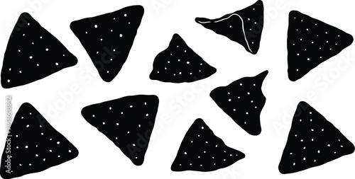 A scattering of black and white tortilla chips on a white background