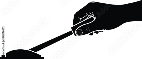 A hand holding a small trowel over a pile of earth or soil