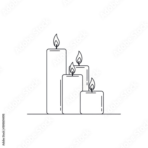Three lit candles in a serene and peaceful setting