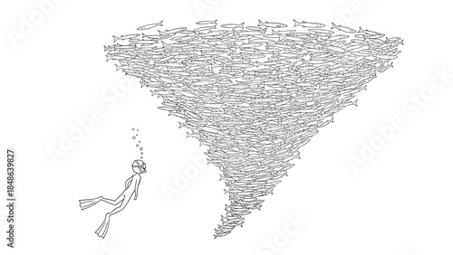 Diver observing a twisting school of fish in underwater ocean scene