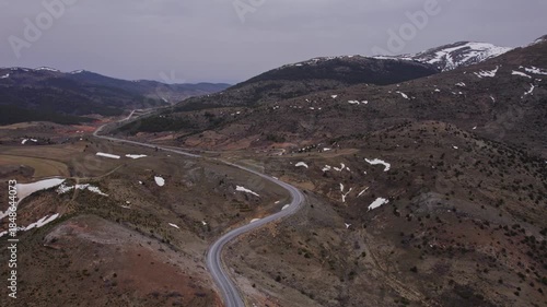 Aerial Drone View of Asphalt Road Between Snowy Mountains in Rural Turkey