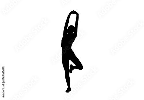 Silhouette of Woman Stretching in Yoga Tree Pose.