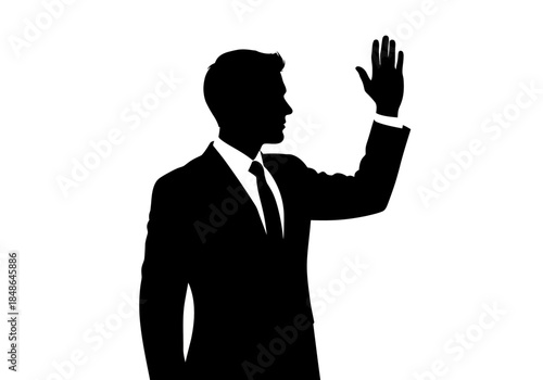 Silhouette of a Man in Suit Raising Hand.