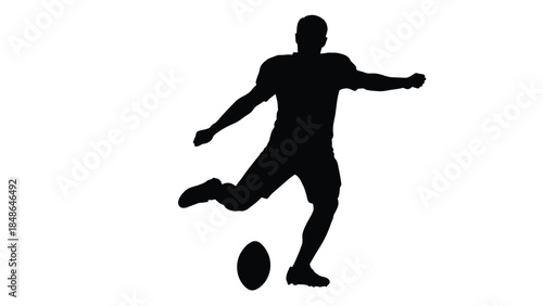 Silhouette of a rugby player executing a powerful kick against a stark white background symbolizing athletic focus and competitive drive