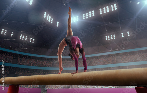 A gymnast performs a difficult trick on a balance beam.