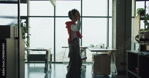 Expressive performer sways in urban daylight environment