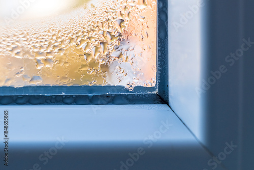 Water droplets, condensation  and mold on a window frame during cold weather.