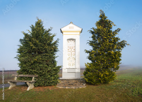 religious statue at village of Ritzing with fog