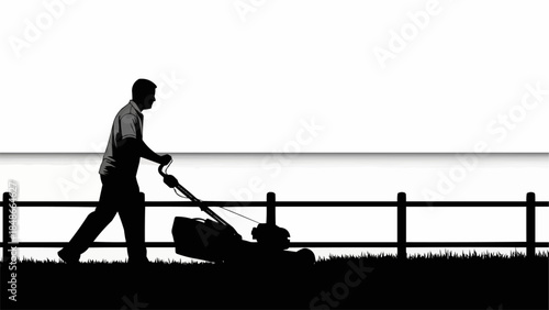 Silhouette of a man mowing the lawn with a push mower.
