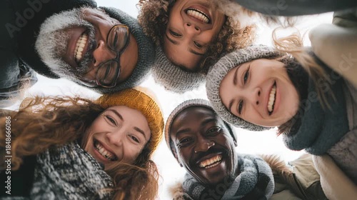 A group of friends from different races standing in a circle, smiling and hugging. A team of cheerful and confident people.