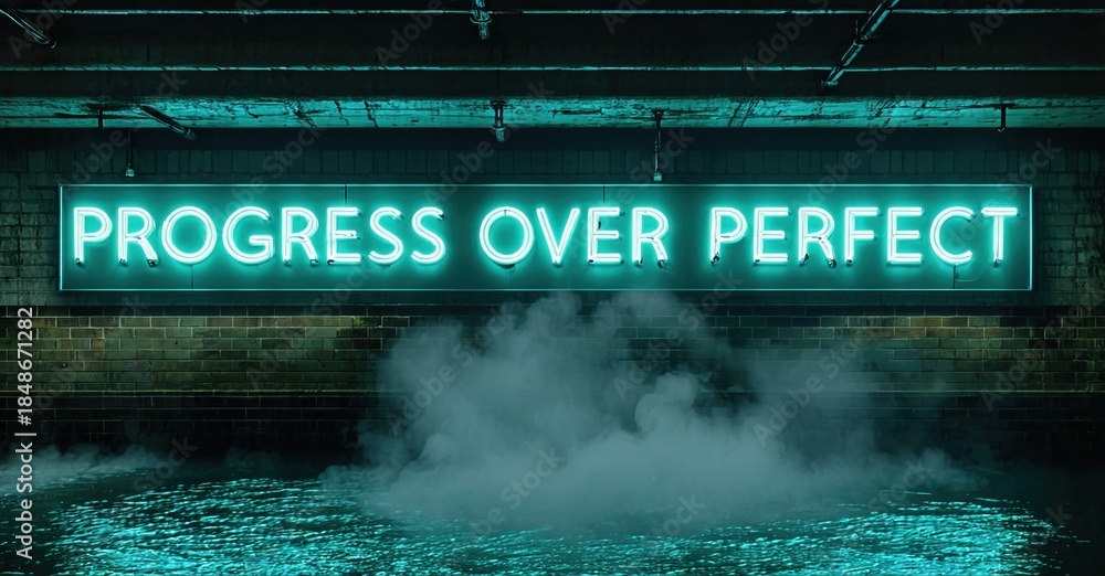 Naklejka premium Neon sign displays motivational phrase. Dark brick wall, steam rising from ground. Dramatic lighting creates moody atmosphere.