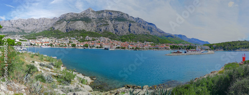 Panoramic view of the town of Makarska, Croatia, along the Adriatic Sea coast with the Biokovo mountains in the background