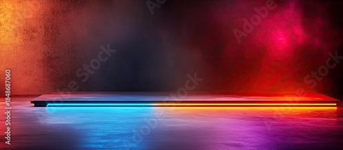 Vibrant neon lights on modern stage in dark room with colorful reflections