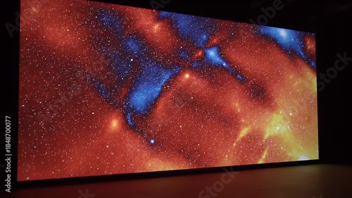 Vibrant Nebula Display Illuminated In Dark Exhibition Space With Fiery Red And Deep Blue Cosmic Hues And Bright Star