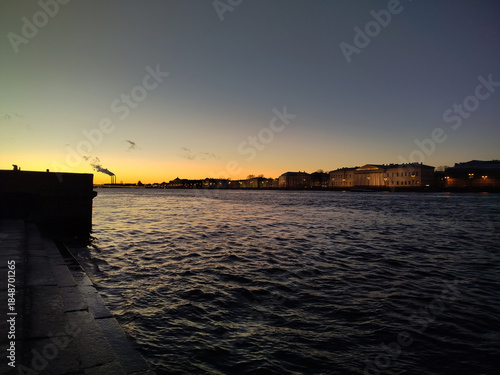 Sunset over the river with city skyline in view