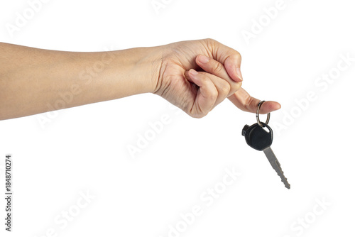 A black motorcycle key in a hand against a transparent background.