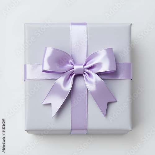 Soft grey square gift box with pastel lilac bow, elegant Valentine theme.