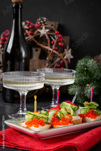 Christmas and New Year's dishes. Snacks and wine drinks for the holiday table. Canapes with red salmon caviar. Overhead