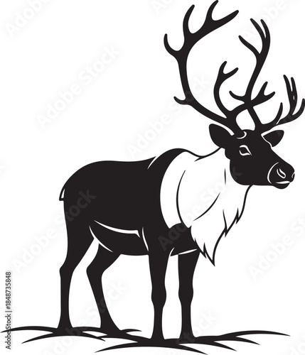 Black silhouette of a reindeer with large antlers standing on ground