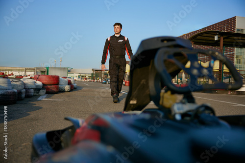 Race car driver preparing for karting competition