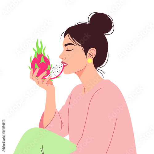 Young woman enjoying dragon fruit while sitting in casual attire  