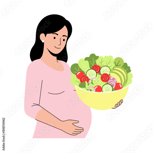 Pregnant woman holding a bowl of fresh salad and smiling  