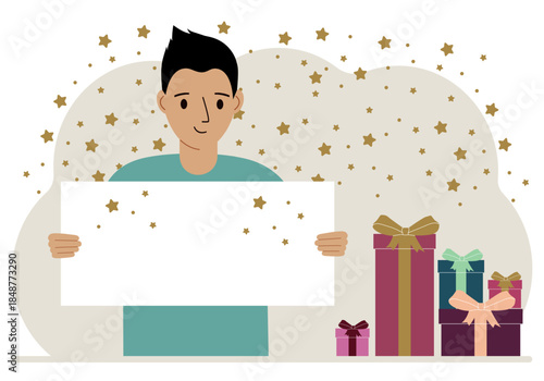 A man holds a card with a greeting card. Nearby are more gifts.