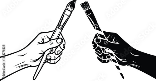 Two hands holding paintbrushes in a creative gesture