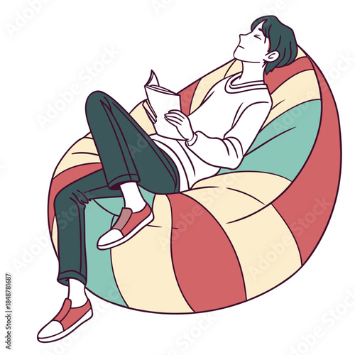 Woman sitting on colorful bean bag chair reading book