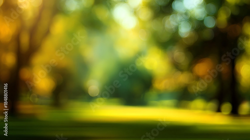 Abstract blurred park scene with yellow and green bokeh lights