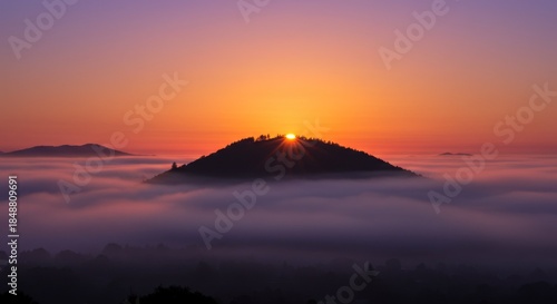 Sunrise Over Foggy Mountain Landscape