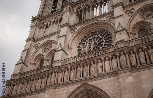 Canvastavla Ornate Gothic facade of Notre-Dame Cathedral in Paris, France, with stone statues and architectural details