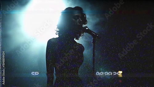 Silhouette of an African ethnicity woman singing to a microphone. VHS retro style music video