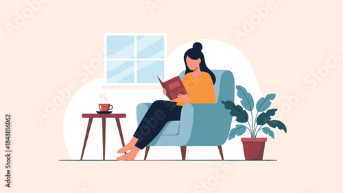 Relaxed woman sitting in a comfortable armchair at home, reading a book with a cup of hot coffee and a houseplant nearby.