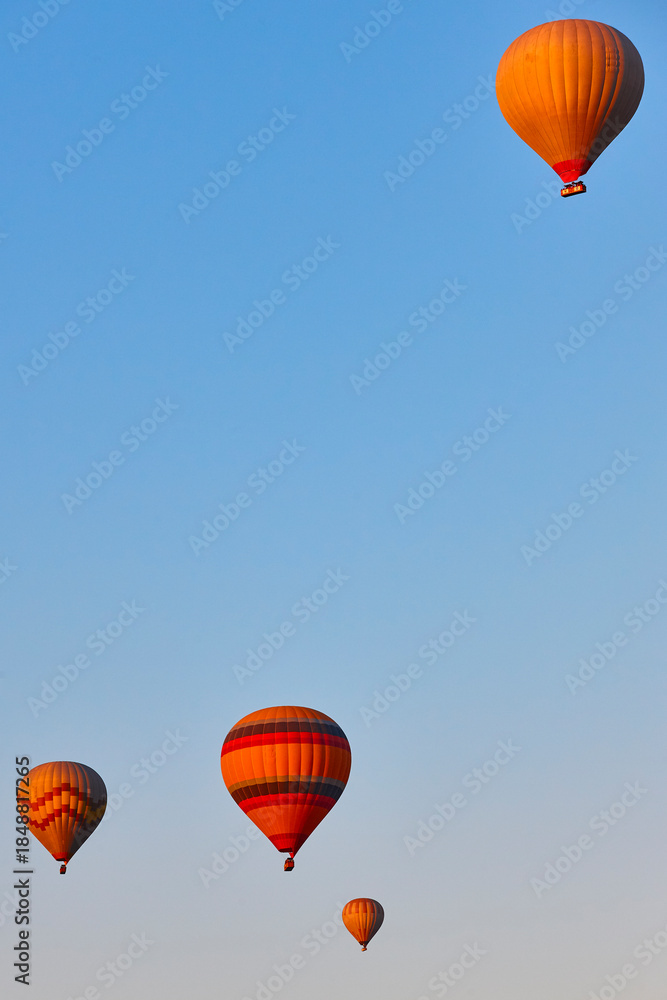 Fototapeta premium Hot balloons at dusk in Cappadocia. Famous flight in Goreme. Turkey