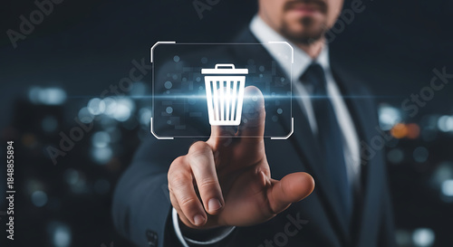 Businessman deleting data by touching futuristic trash bin icon on digital interface