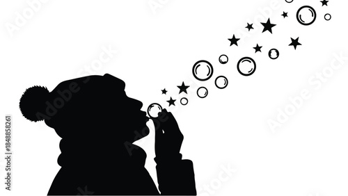 Joyful child blowing bubbles and stars into the air on a bright day