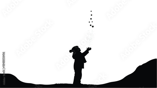 Child in silhouette looking up at falling snow, embracing winter wonder