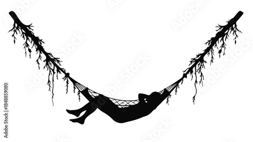 Silhouette of a person relaxing peacefully in a hammock suspended between two trees
