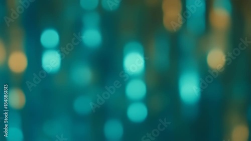 An abstract image featuring bokeh orbs in shades of turquoise, teal, and gold, with a soft blur