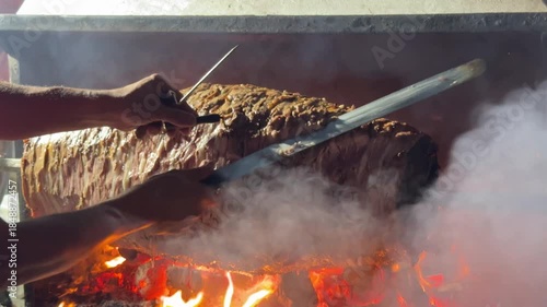 Doner Kebab Traditional Turkish Food Cag Kebabi. Rolling lamb meat doner kebab