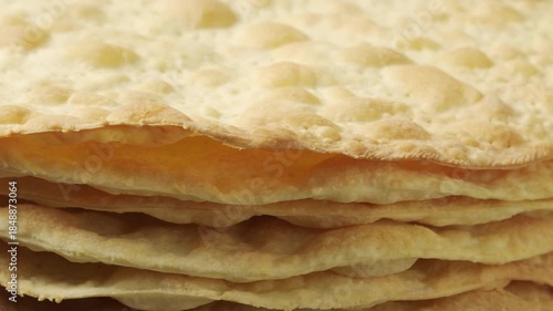Stack of Baked Cake Layers Rotating: Close-up of crispy golden puff pastry crusts for traditional Napoleon cake or mille-feuille dessert