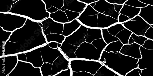 Abstract black and white cracked earth texture showing dry, fractured ground patterns. High-contrast natural surface background symbolizing drought, climate change, arid land, and environmental stress