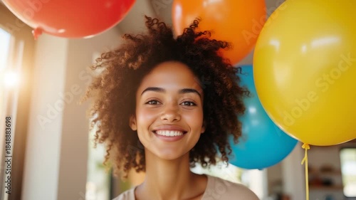 Happy Young Woman with Natural Curly Hair and Party Balloons - Authentic Joyful Portrait for Lifestyle Marketing and Celebration Content